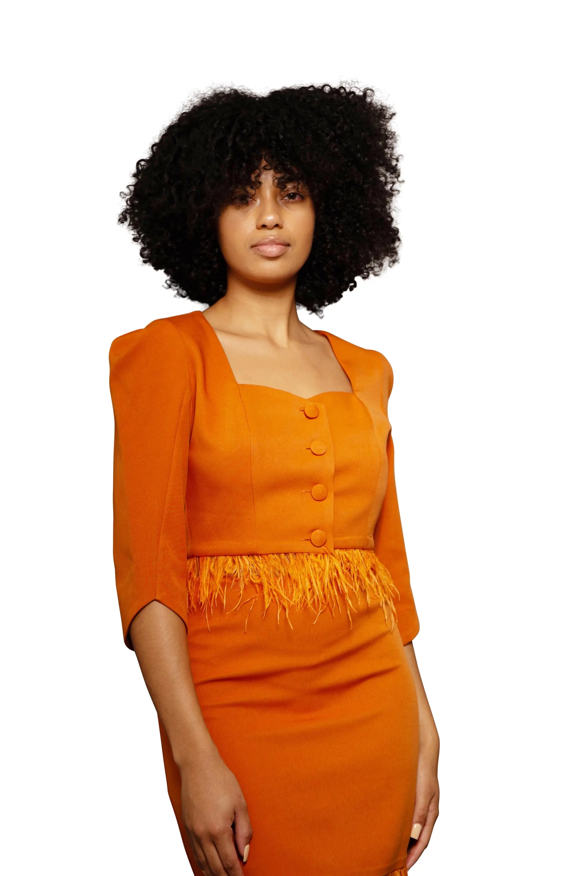 Model wearing an orange dress closeup