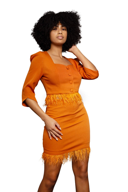 Model wearing an orange mini dress 