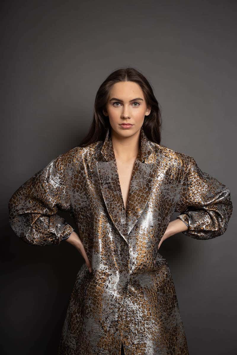 woman wearing snake print jacket