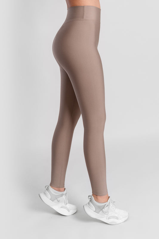 Model with stone color leggings, right side view