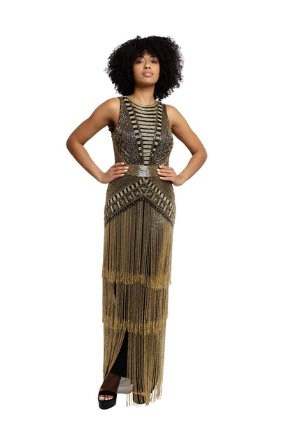 Model wearing a weaved gold dress, full view, 