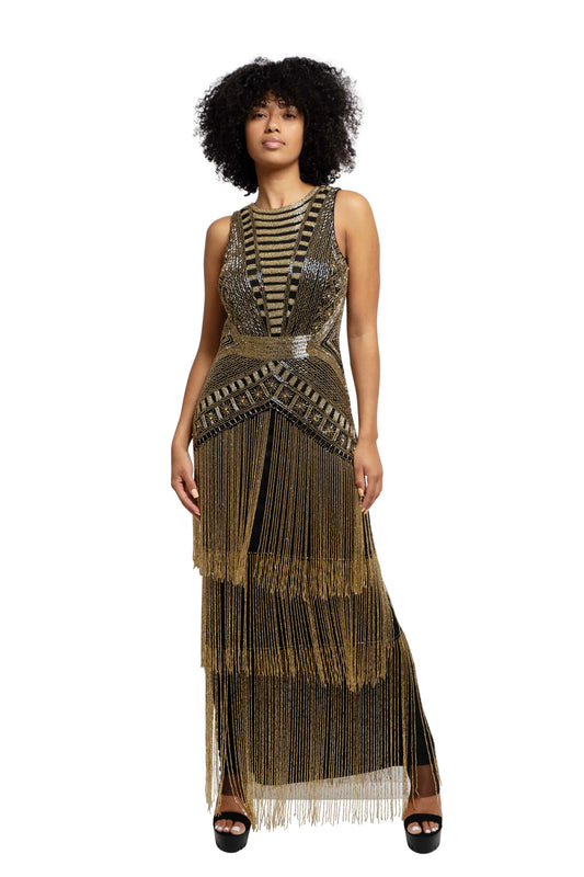 Model wearing a weaved gold dress, front view